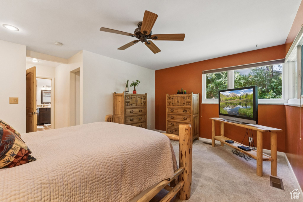 Bedroom featuring light carpet and ceiling fan