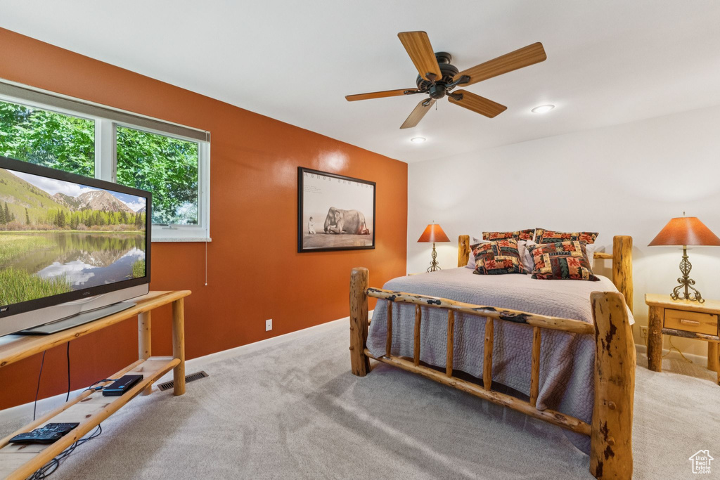 Bedroom with carpet, recessed lighting, and a ceiling fan