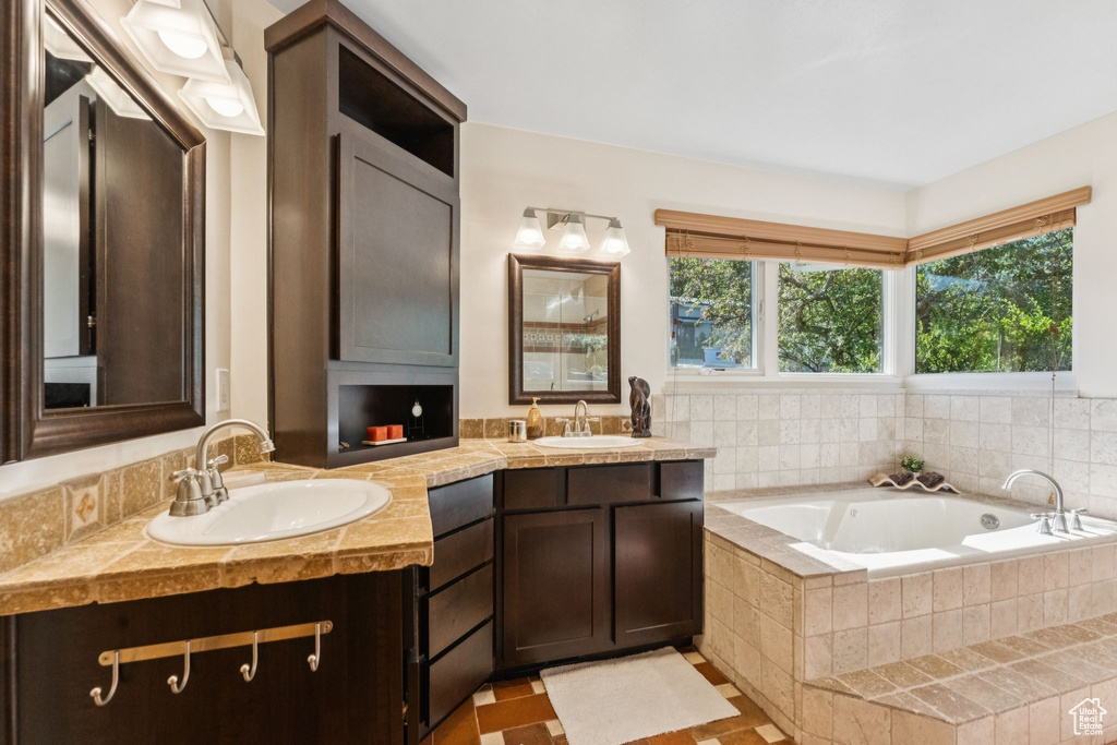 Bathroom with double vanity and a garden tub