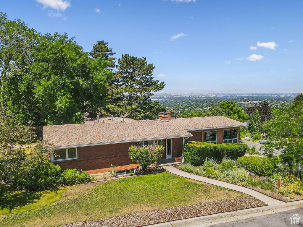 Single story home featuring a front yard
