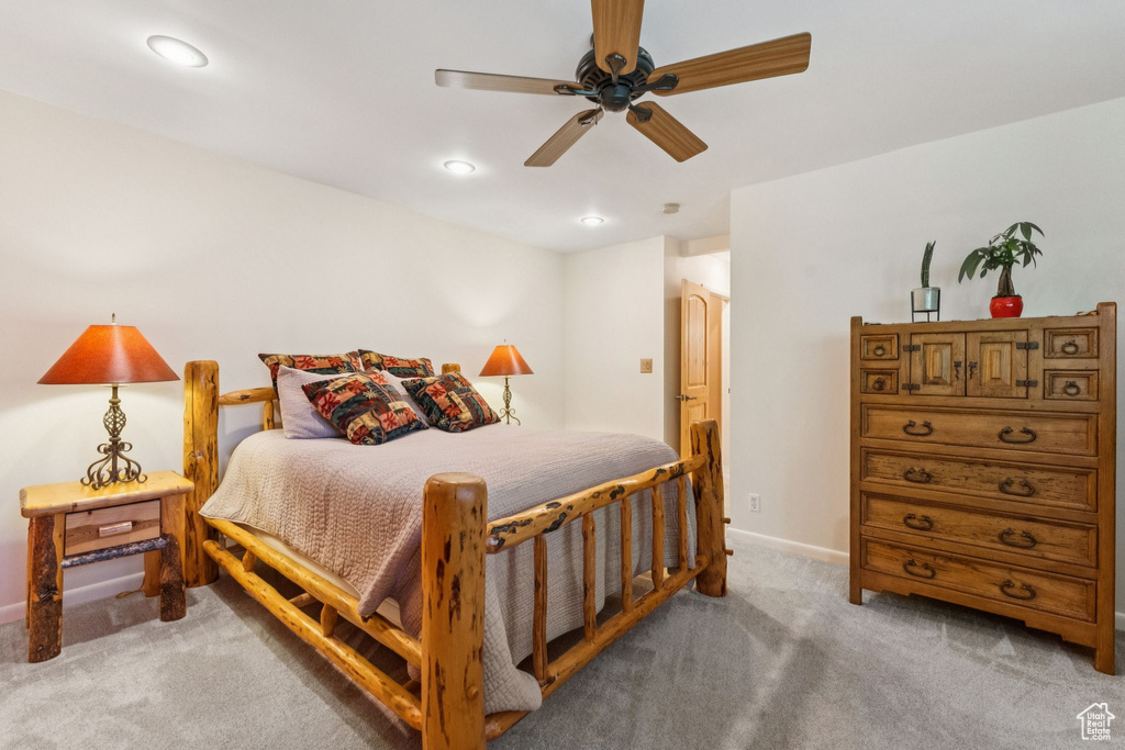 Bedroom with light carpet, recessed lighting, and ceiling fan