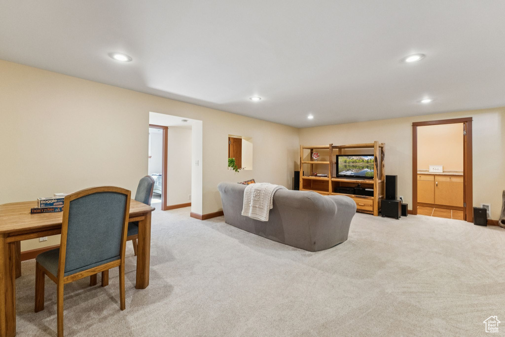 Living room with recessed lighting and carpet