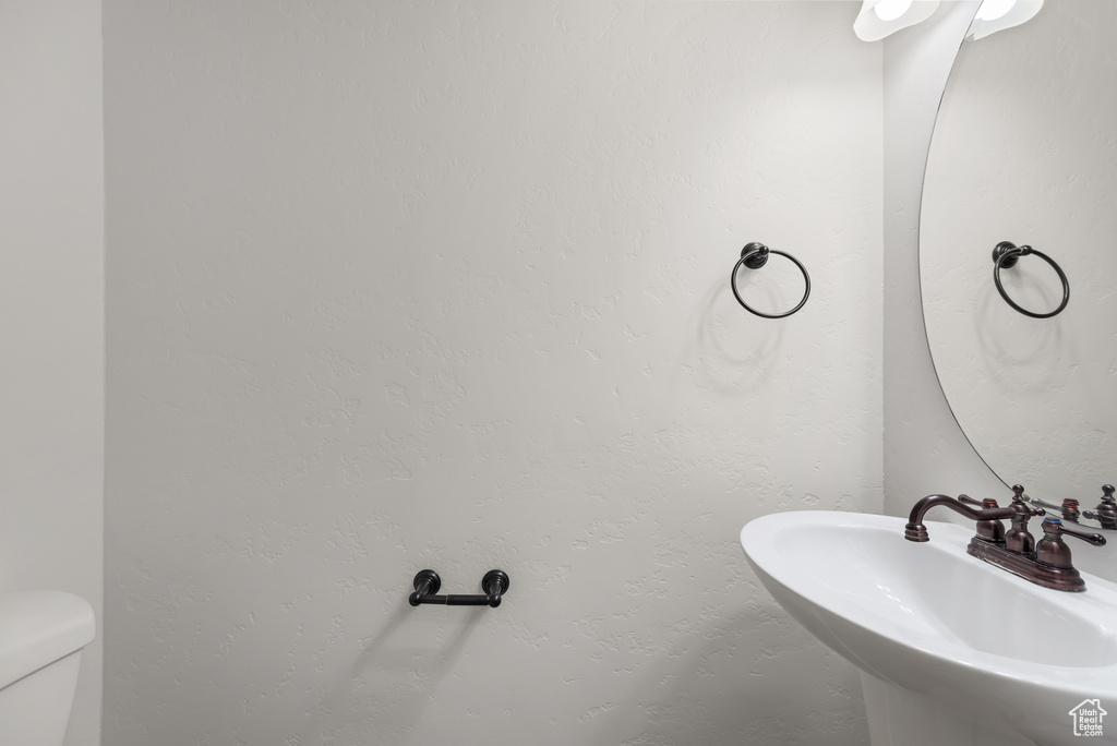 Bathroom featuring a sink and toilet