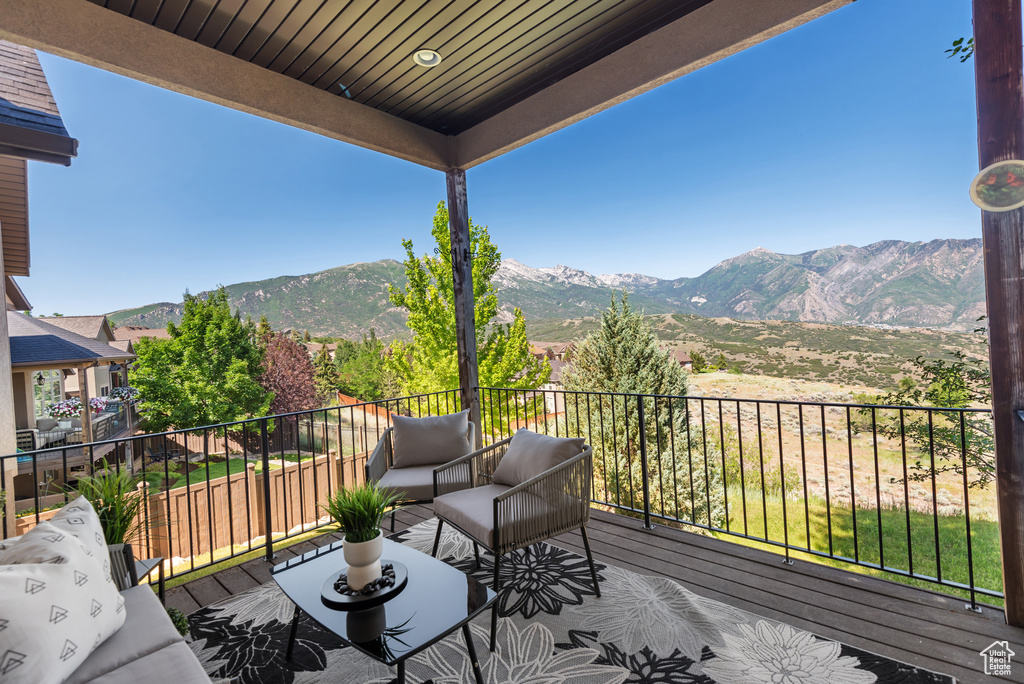 Wooden deck featuring a mountain view