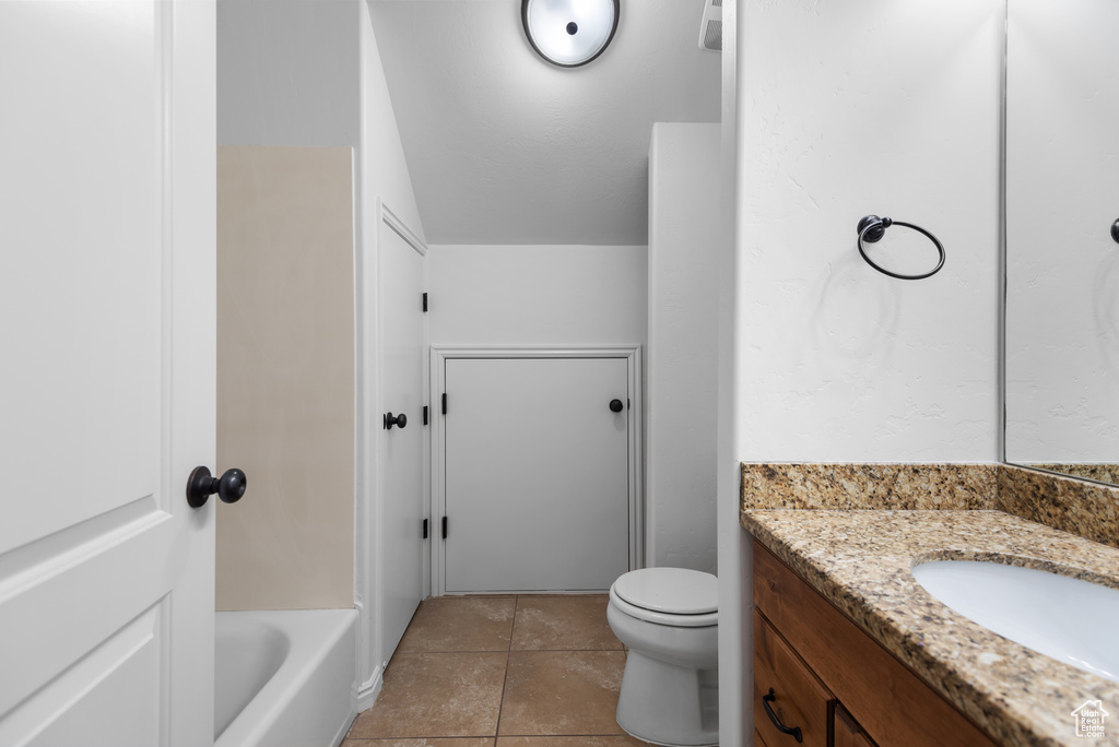 Bathroom with vanity and tile patterned floors