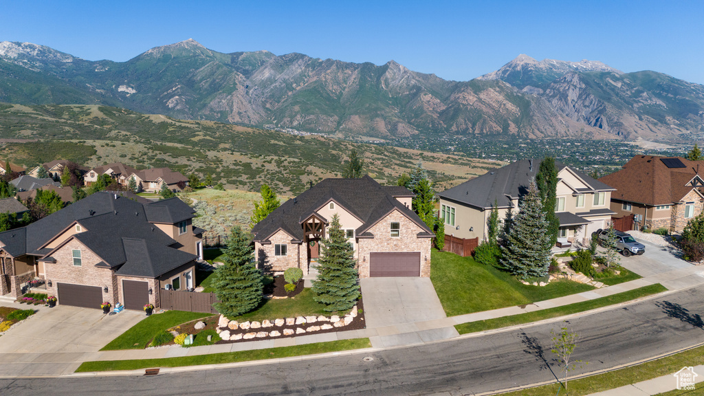 View of mountain backdrop featuring nearby suburban area