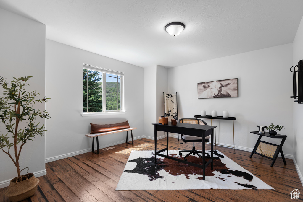 Office area featuring wood finished floors