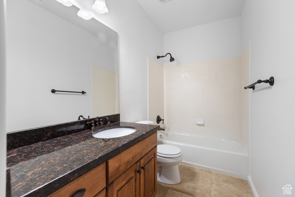 Full bath with vanity, tub / shower combination, and tile patterned floors