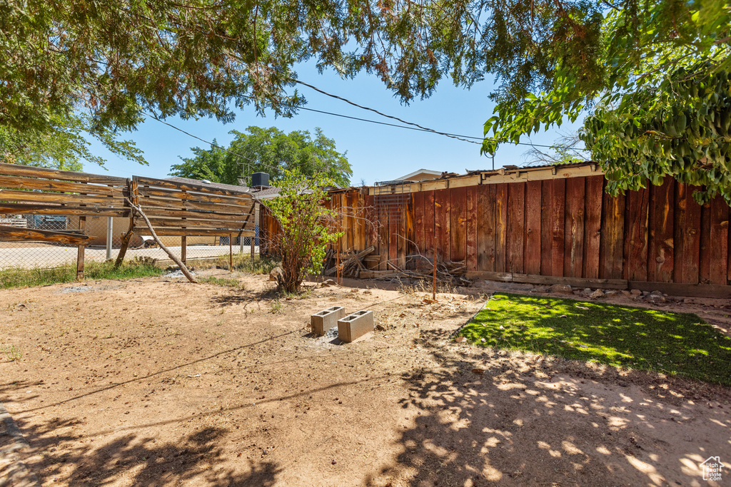View of fenced backyard
