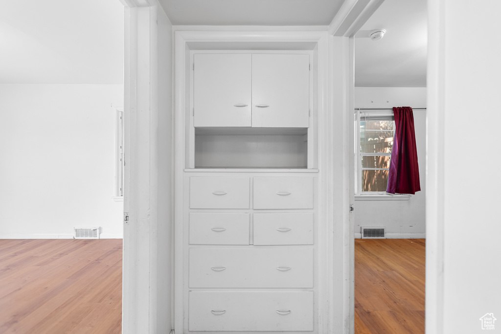 Spacious closet featuring wood finished floors