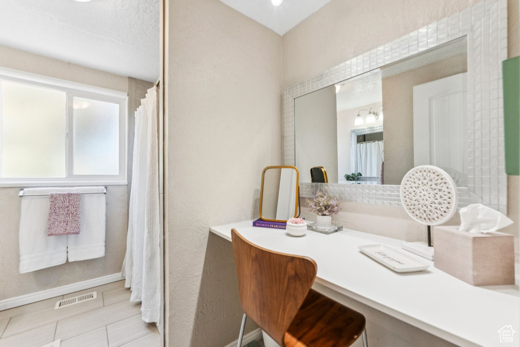 Home office featuring baseboards and tile patterned flooring