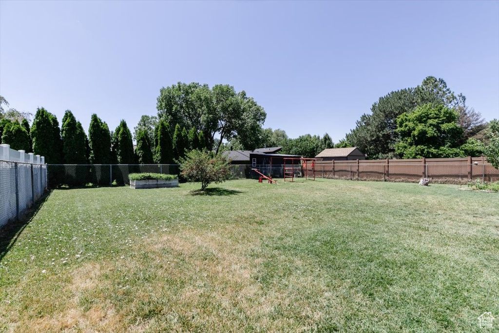 View of fenced backyard