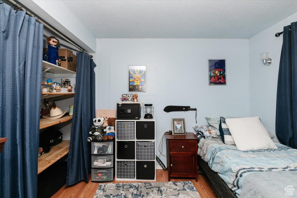 Bedroom featuring wood finished floors