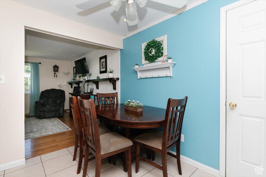 Dining room featuring ceiling fan and light tile patterned flooring