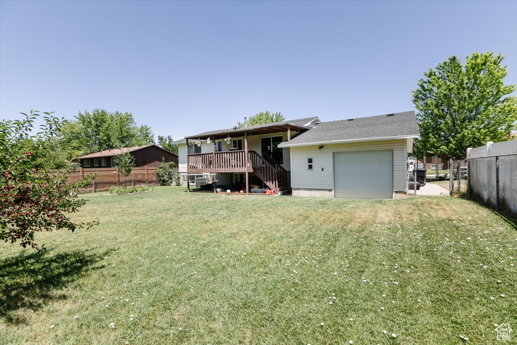 Back of house with stairs and a deck