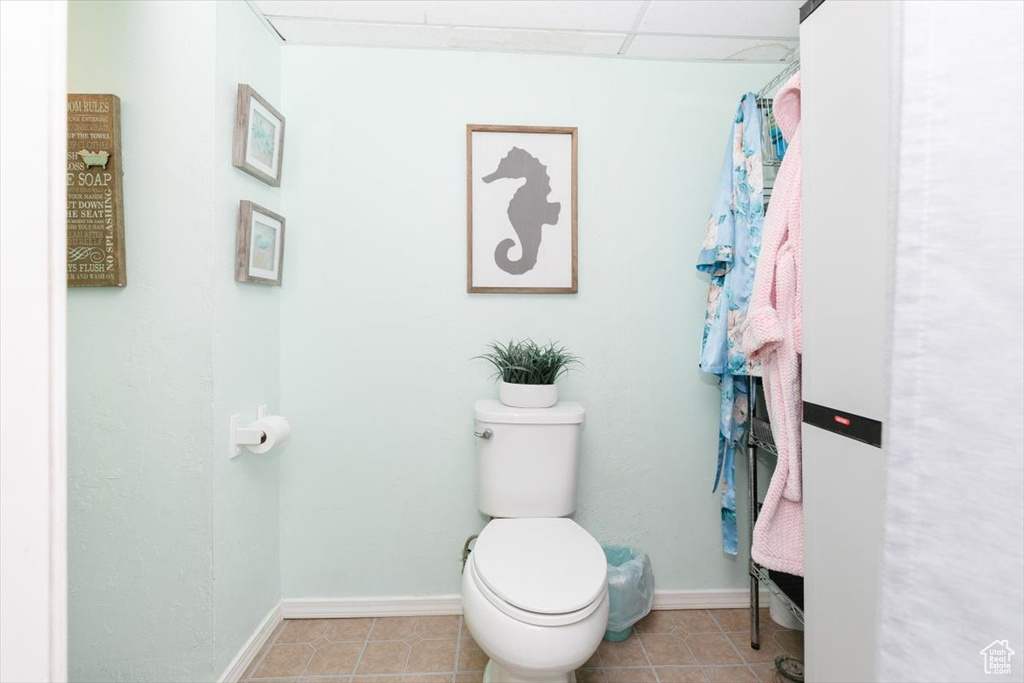 Bathroom with toilet and tile patterned floors