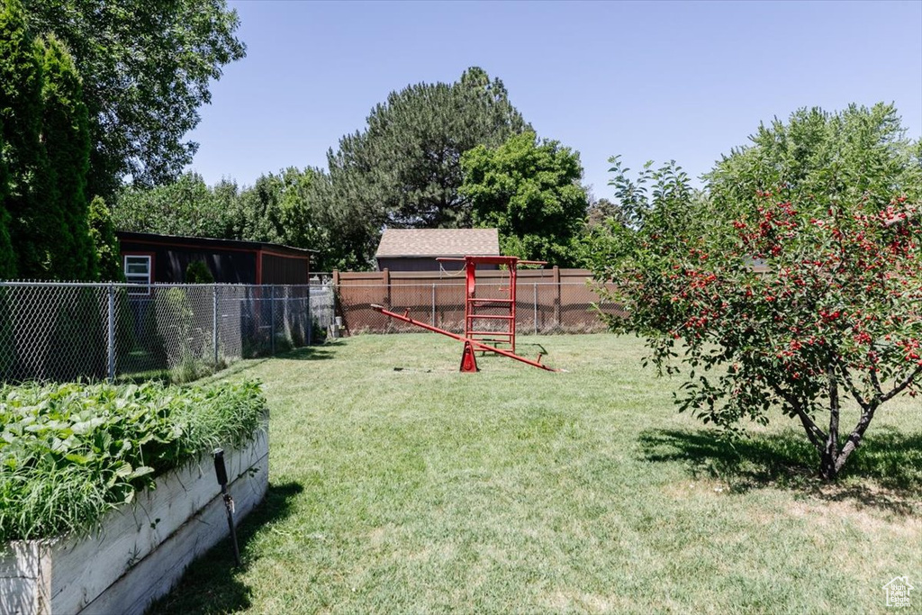 View of fenced backyard