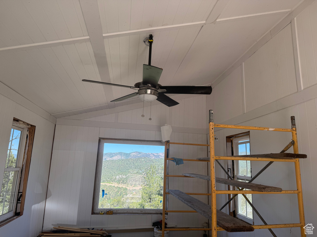 Detailed view of a ceiling fan and wood ceiling