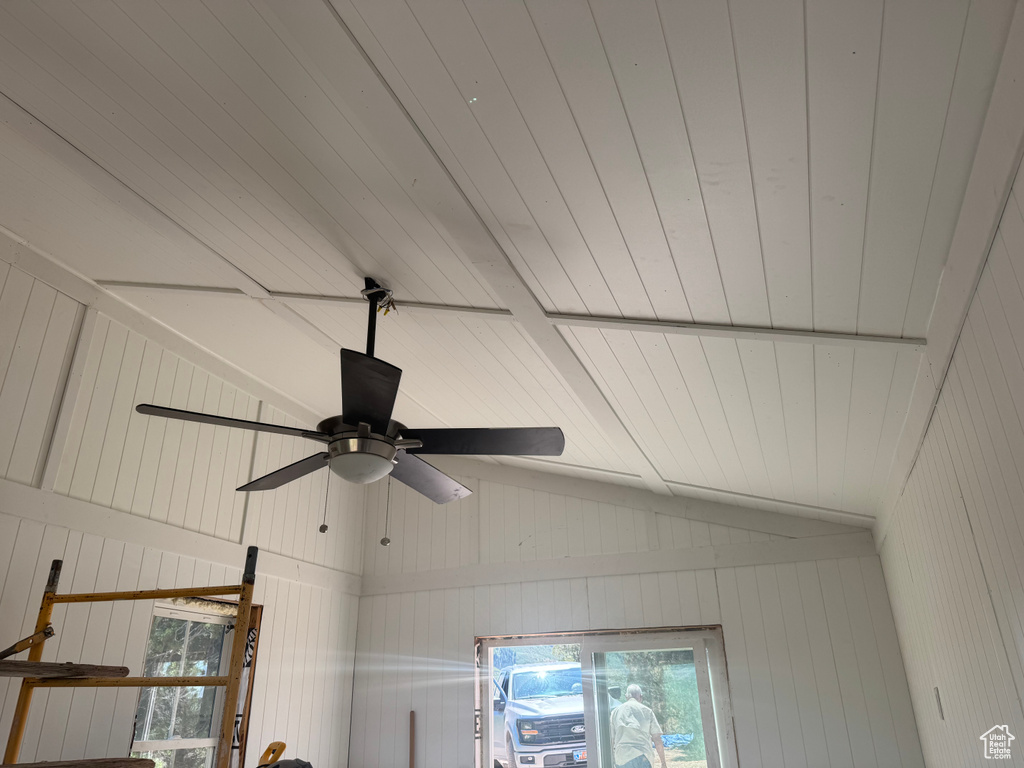 Detailed view of ceiling fan and beamed ceiling