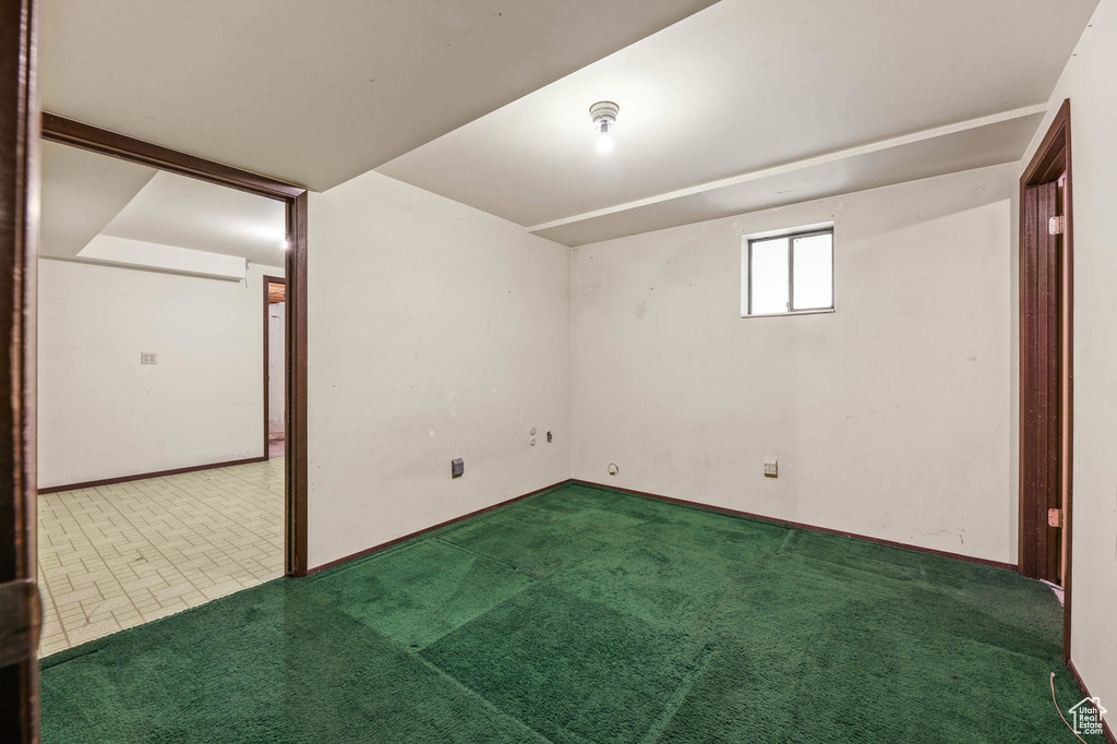Additional living space featuring carpet