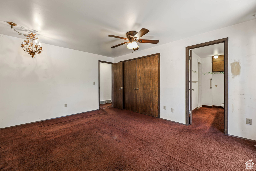 Unfurnished bedroom with carpet flooring and a closet