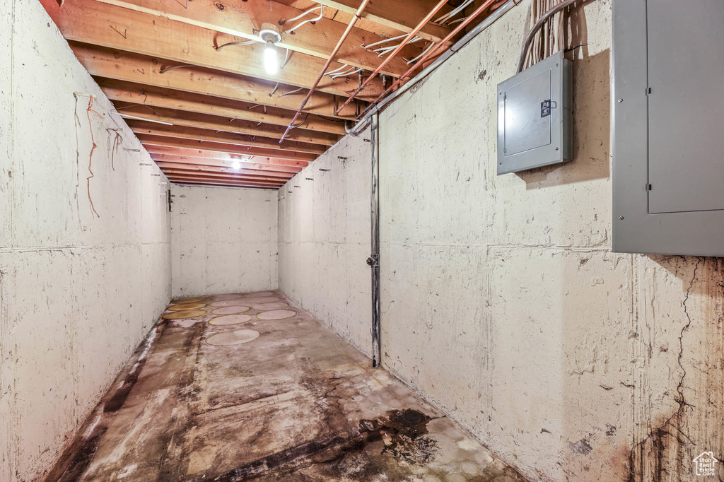 Unfinished basement featuring electric panel