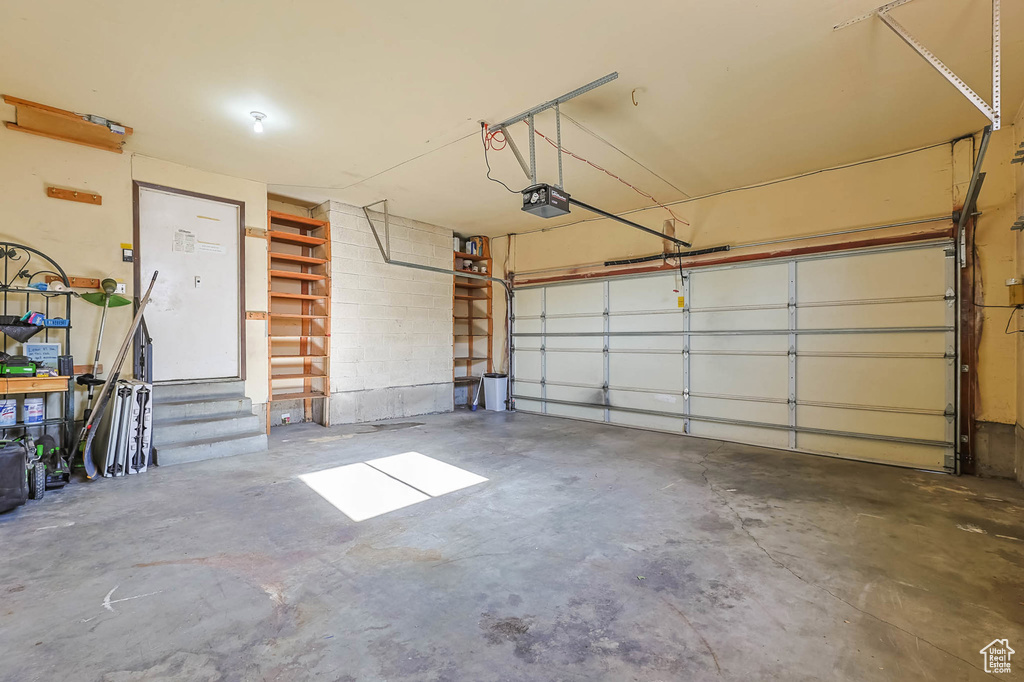 Garage featuring a garage door opener
