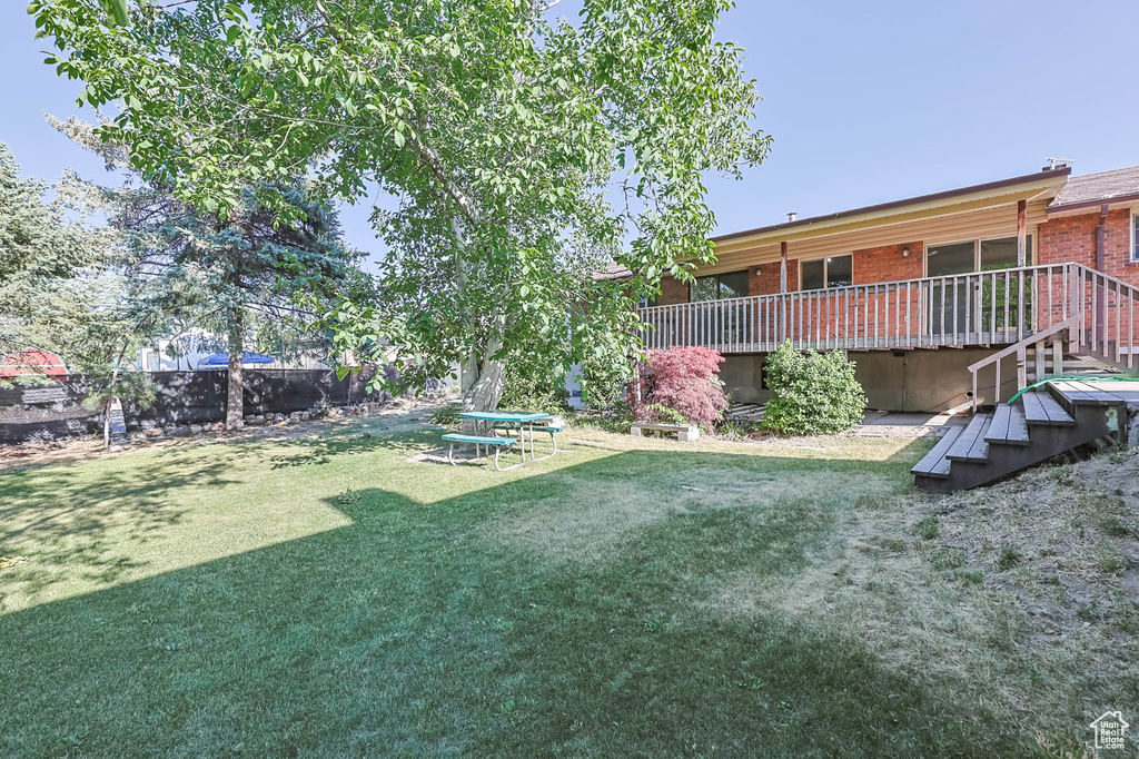 View of yard featuring a wooden deck