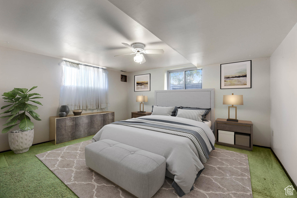 Carpeted bedroom with ceiling fan