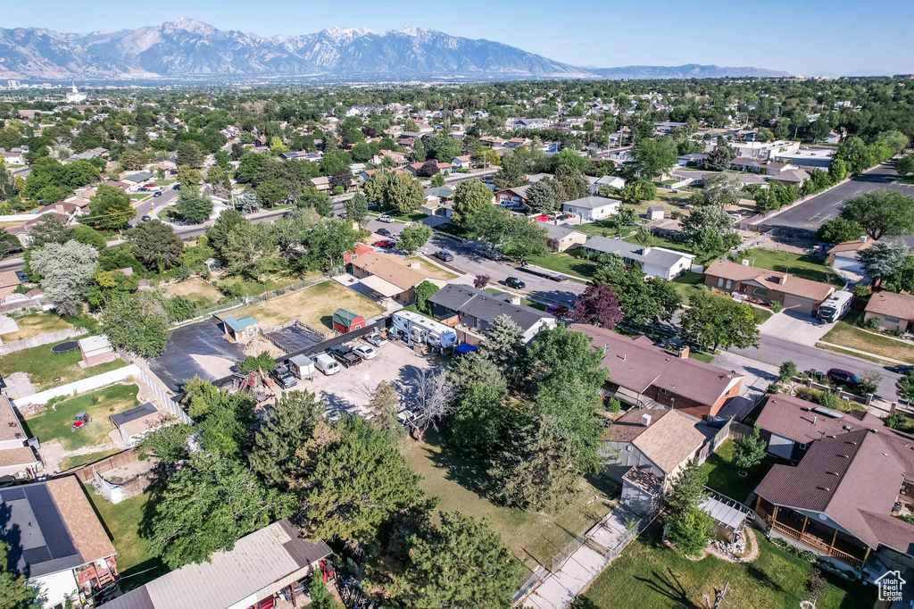 Aerial view of property\'s location with a mountainous background and nearby suburban area