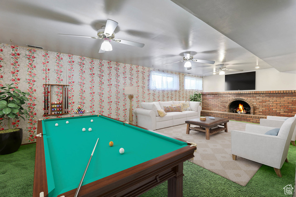 Playroom featuring carpet flooring, ceiling fan, a fireplace, billiards table, and wallpapered walls