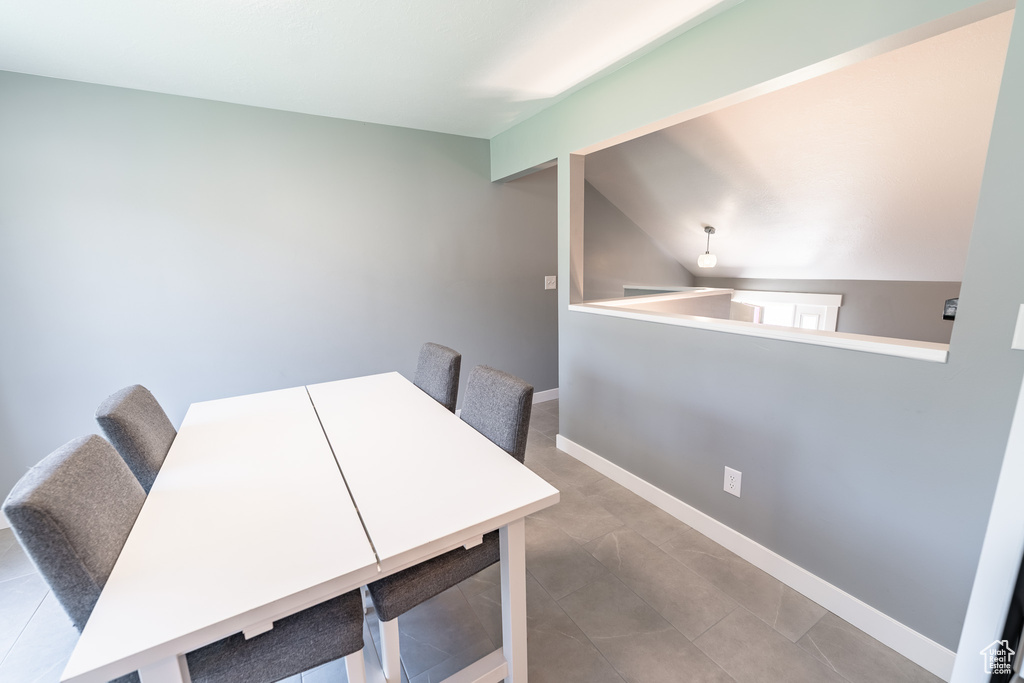 Unfurnished dining area featuring baseboards