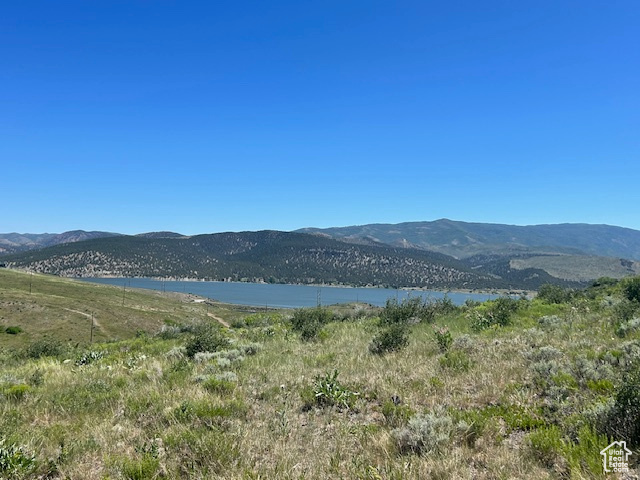 View of mountain backdrop with a nearby body of water