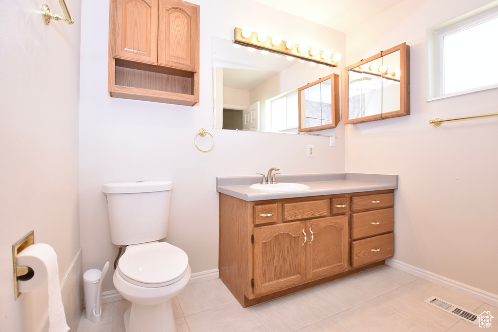 Bathroom with vanity and tile patterned flooring