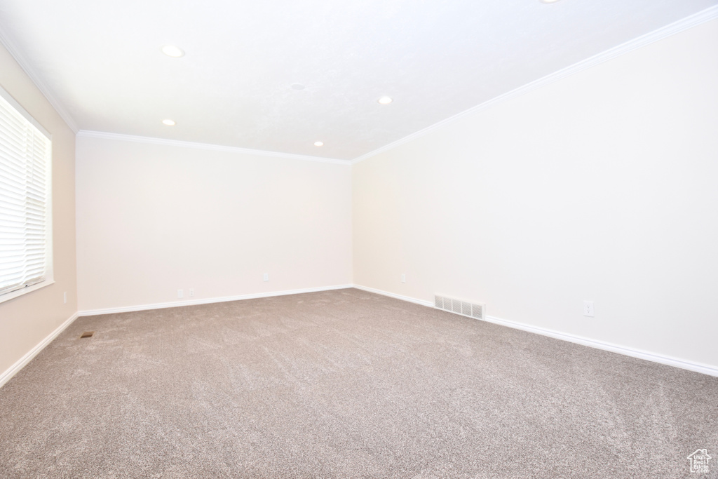 Unfurnished room featuring recessed lighting, carpet flooring, and ornamental molding