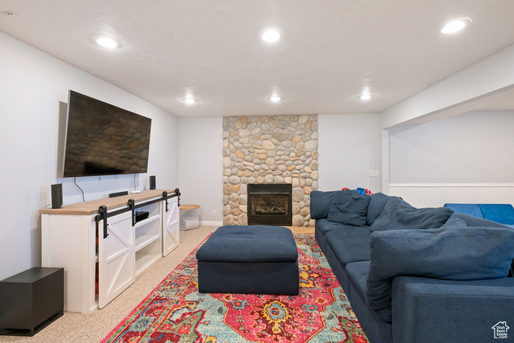 Living room with light colored carpet and recessed lighting