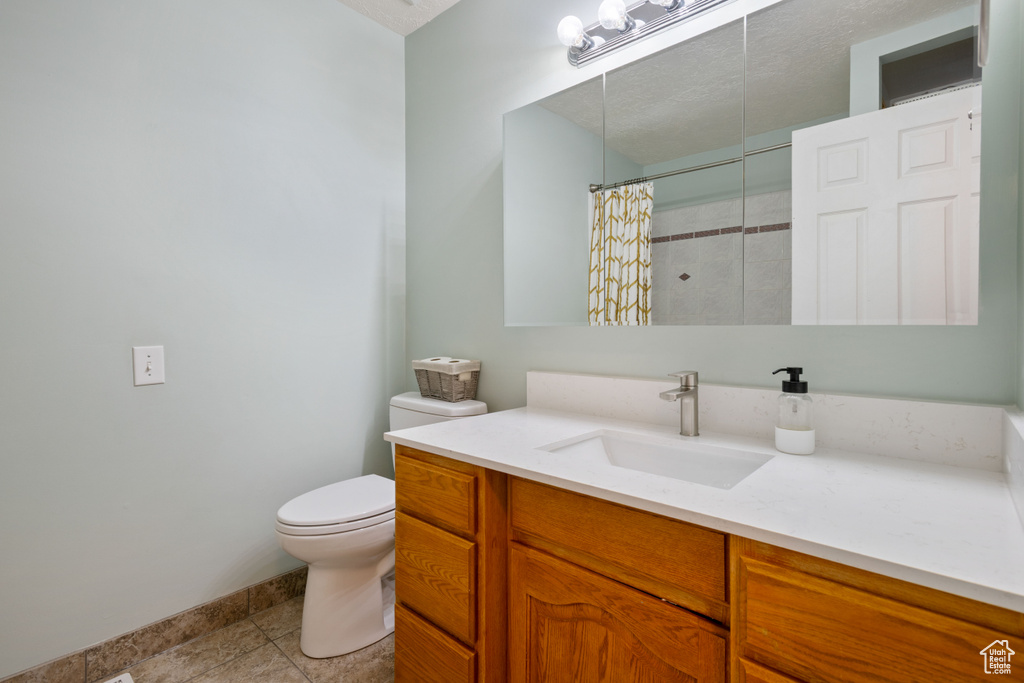 Bathroom with vanity and a shower with shower curtain