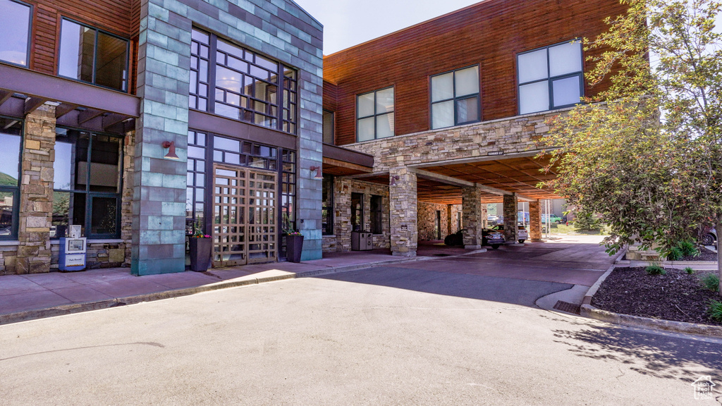View of building exterior with a carport