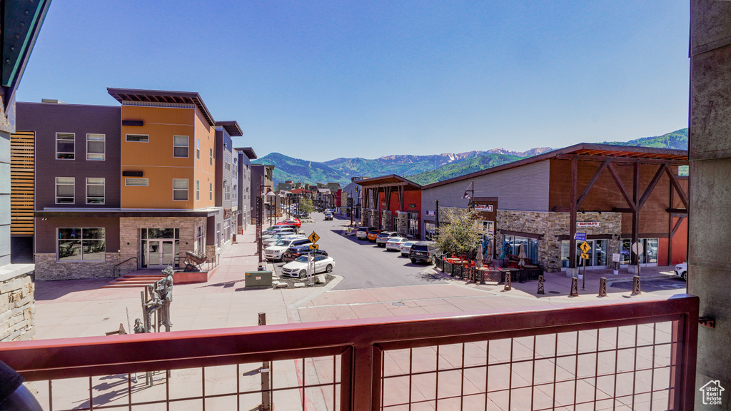 View of road featuring a mountain view, sidewalks, and curbs