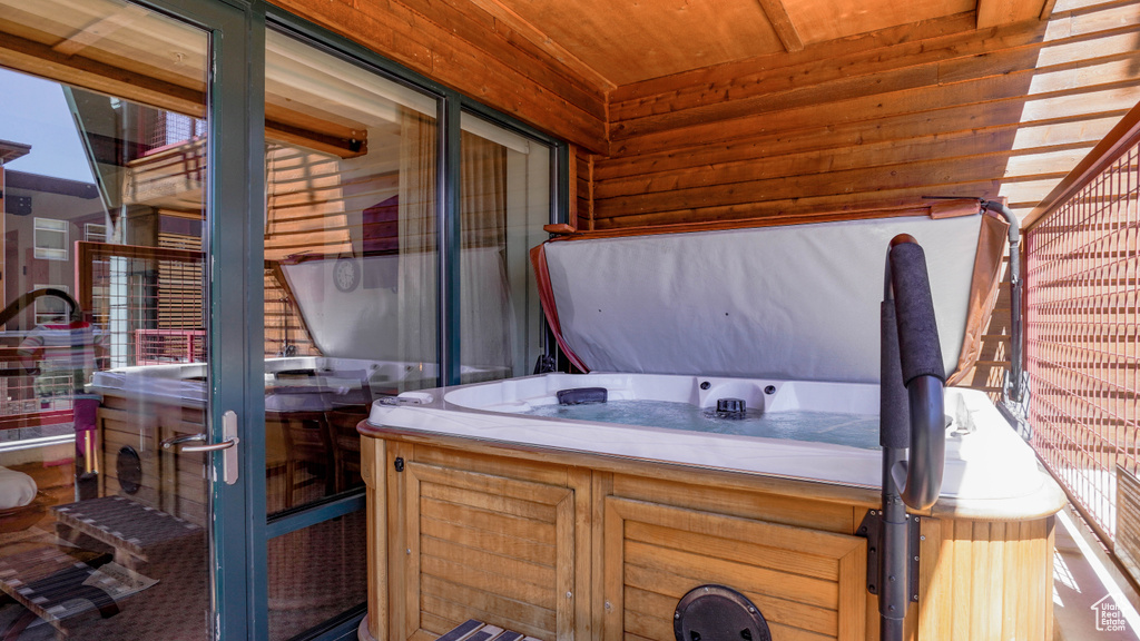View of patio featuring a hot tub