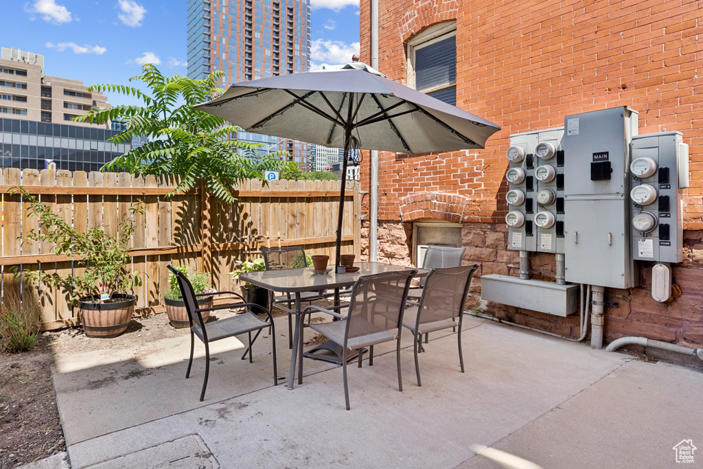 View of patio with outdoor dining area