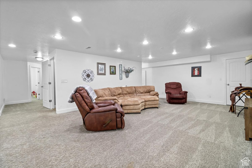 Carpeted living room featuring recessed lighting