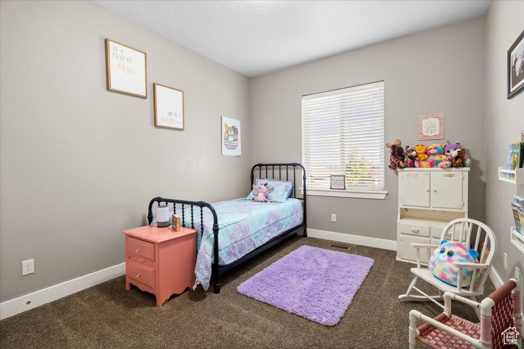 Carpeted bedroom with baseboards