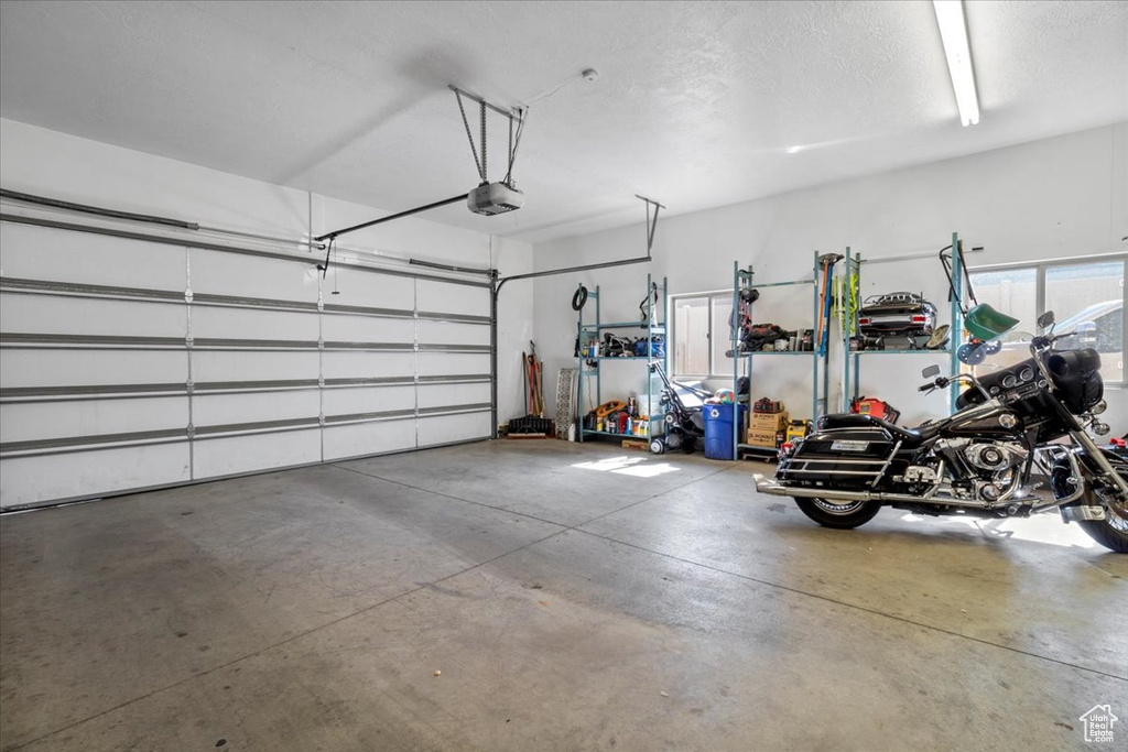 Garage featuring a garage door opener