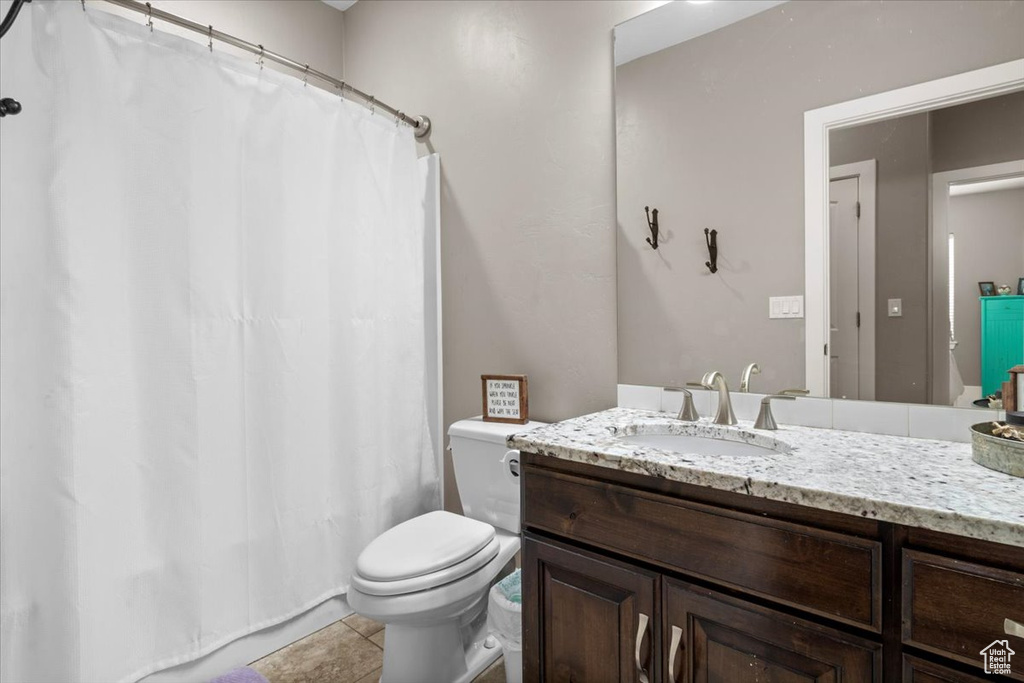 Bathroom featuring vanity and tile patterned flooring