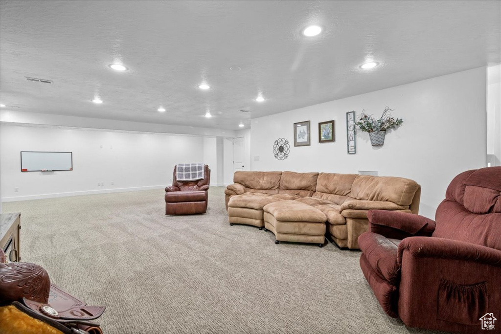 Living room featuring carpet and recessed lighting