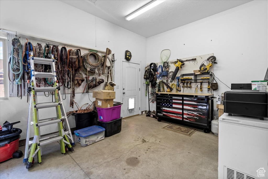 Garage featuring a workshop area