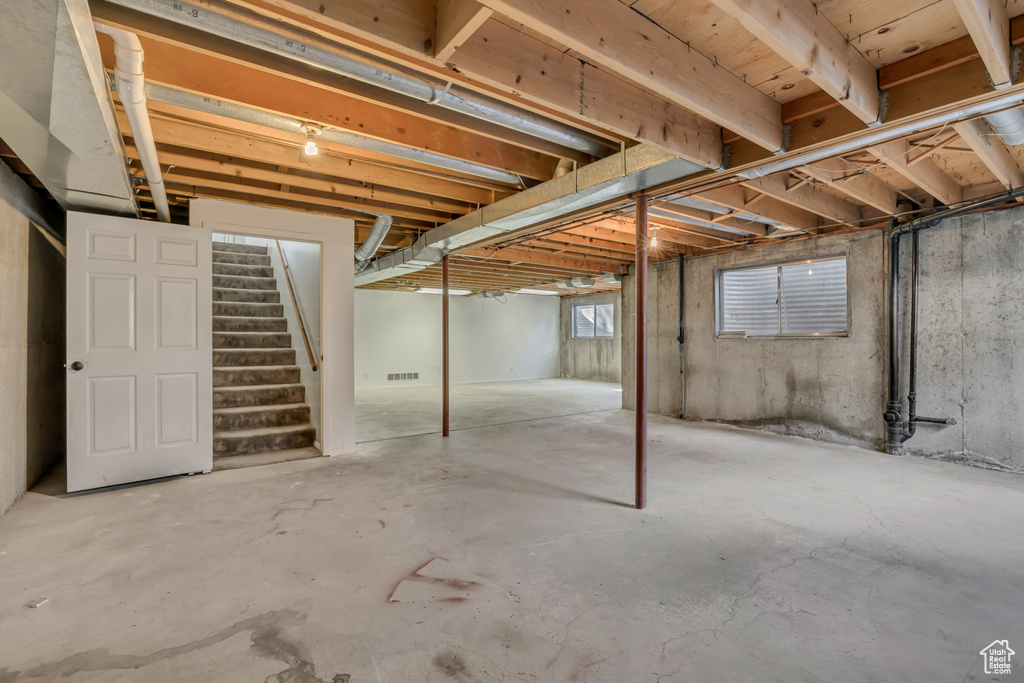 Basement featuring stairway