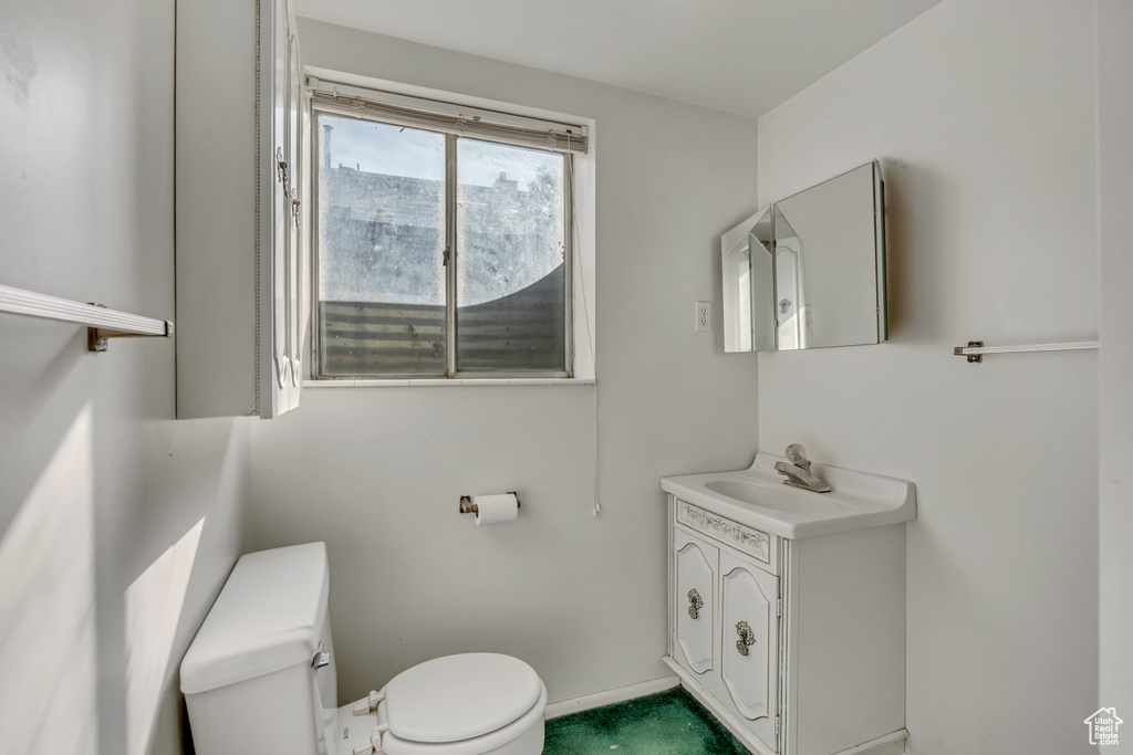 Bathroom featuring toilet and vanity