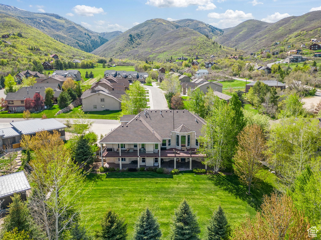 Aerial perspective of suburban area featuring a mountainous background